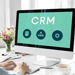 desktop computer showing a crm on screen